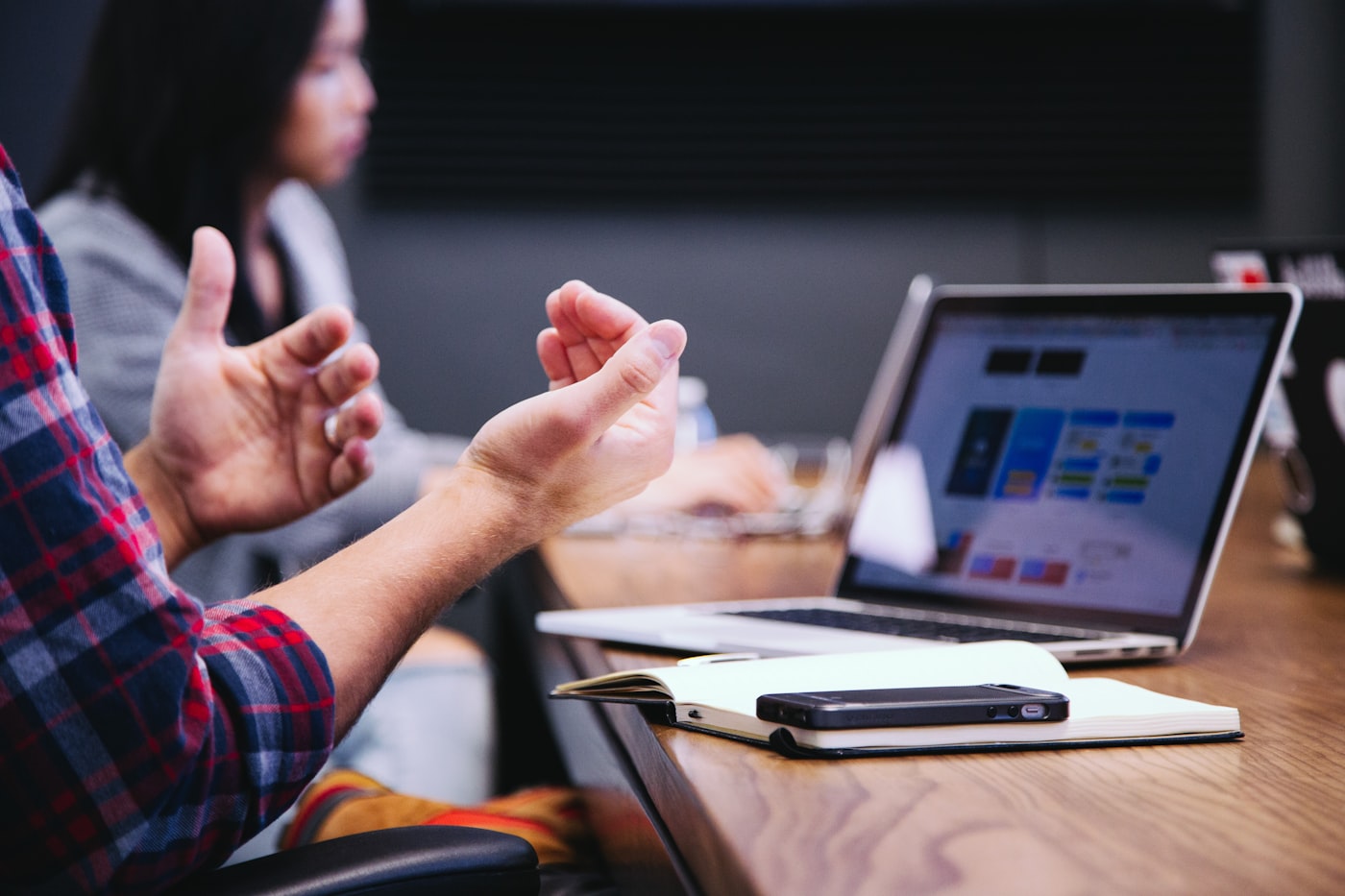Team meeting around data screens